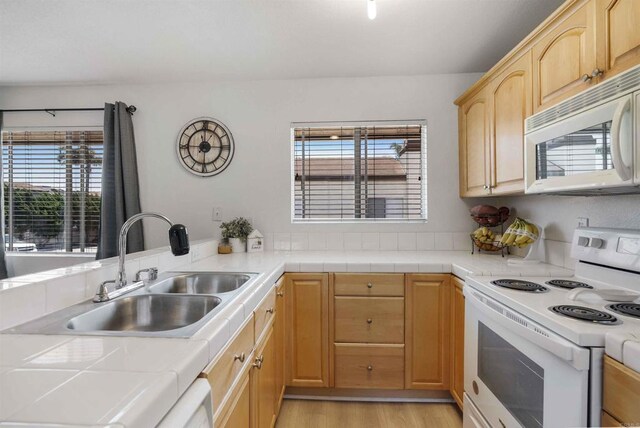 1025 4th Ave Unit 8, Chula Vista, CA 91911 - kitchen with white appliances, a sink, and tile counters
