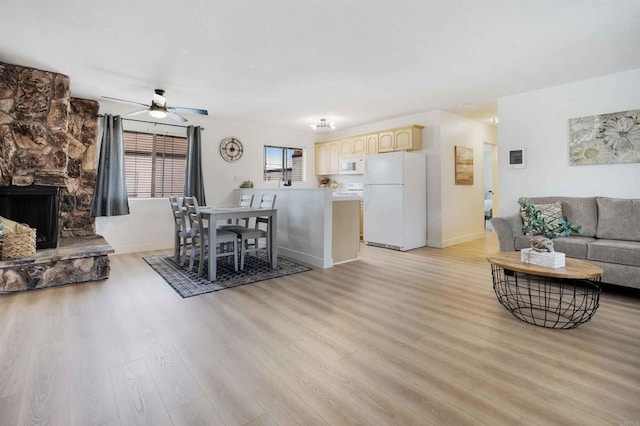 1025 4th Ave Unit 8, Chula Vista, CA 91911 - living area featuring light wood-style flooring, a ceiling fan, baseboards, and a fireplace