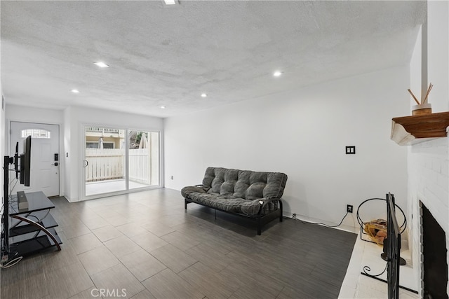 8121 Canby Ave Unit 4, Reseda, CA 91335 - living area with recessed lighting, a textured ceiling, and a fireplace