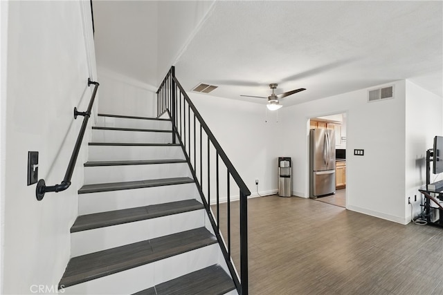 8121 Canby Ave Unit 4, Reseda, CA 91335 - stairs featuring a ceiling fan, wood finished floors, and baseboards