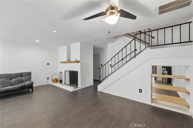 8121 Canby Ave Unit 4, Reseda, CA 91335 - living area featuring stairway, a ceiling fan, recessed lighting, a fireplace with raised hearth, and wood finished floors
