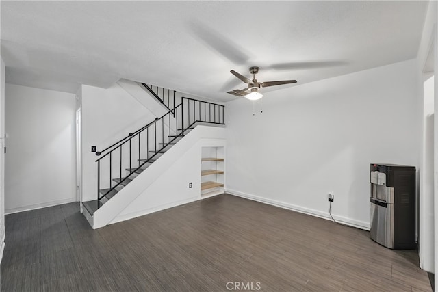 8121 Canby Ave Unit 4, Reseda, CA 91335 - unfurnished living room featuring a ceiling fan, stairway, baseboards, and dark wood-style flooring