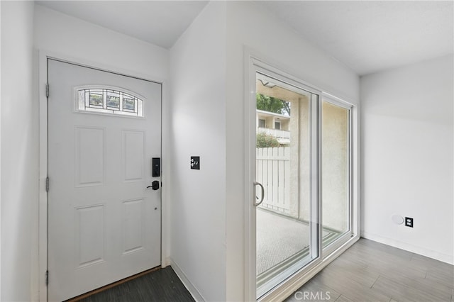 8121 Canby Ave Unit 4, Reseda, CA 91335 - entrance foyer featuring dark wood-style floors and baseboards