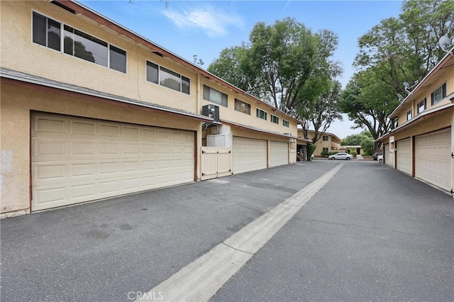 8121 Canby Ave Unit 4, Reseda, CA 91335 - view of asphalt road with community garages