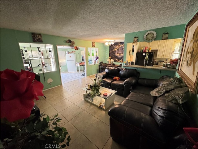 45529 Sancroft Ave, Lancaster, CA 93535 - living room featuring a textured ceiling, light tile patterned floors, and a chandelier