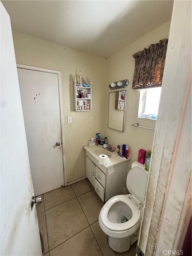 45529 Sancroft Ave, Lancaster, CA 93535 - bathroom featuring tile patterned floors, vanity, and toilet