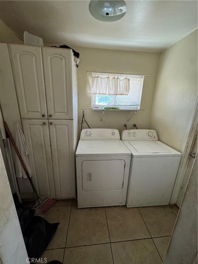 45529 Sancroft Ave, Lancaster, CA 93535 - laundry area with cabinet space, independent washer and dryer, and light tile patterned flooring