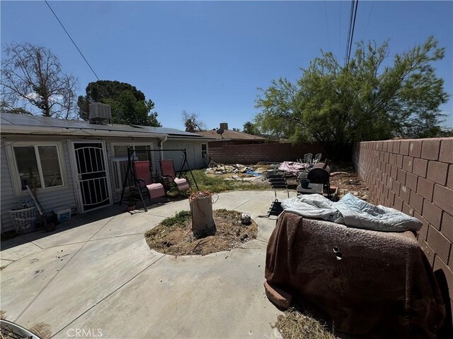 45529 Sancroft Ave, Lancaster, CA 93535 - fenced backyard with a patio area and central AC unit