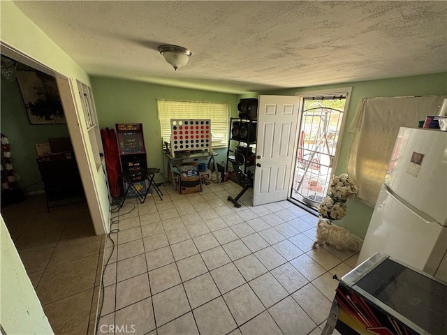 45529 Sancroft Ave, Lancaster, CA 93535 - foyer entrance featuring light tile patterned floors and a textured ceiling