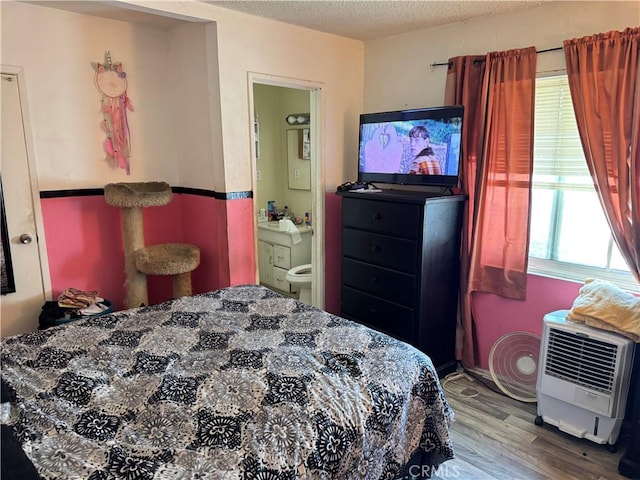 45529 Sancroft Ave, Lancaster, CA 93535 - bedroom featuring wood finished floors, a textured ceiling, and heating unit