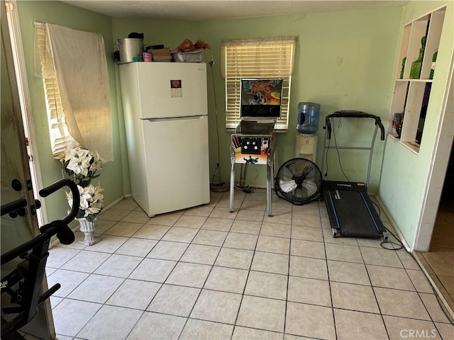 45529 Sancroft Ave, Lancaster, CA 93535 - kitchen featuring freestanding refrigerator and light tile patterned flooring