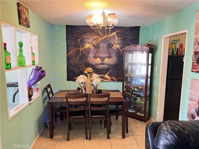 45529 Sancroft Ave, Lancaster, CA 93535 - tiled dining room featuring a chandelier and a textured ceiling