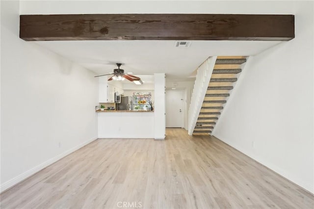 25447 Pine Creek Ln, Wilmington, CA 90744 - unfurnished living room featuring stairs, light wood finished floors, a ceiling fan, baseboards, and beam ceiling