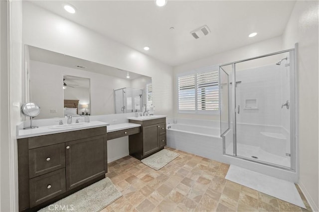11066 Guffey Ranch Way, Corona, CA 92883 - bathroom featuring a shower stall, a garden tub, two vanities, stone finish floors, and ceiling fan