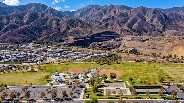 11066 Guffey Ranch Way, Corona, CA 92883 - aerial view of property's location featuring a mountain backdrop and nearby suburban area