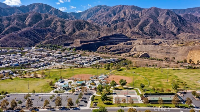 11066 Guffey Ranch Way, Corona, CA 92883 - aerial overview of property's location featuring a mountain backdrop and nearby suburban area