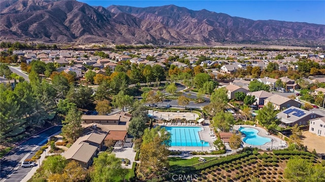 11066 Guffey Ranch Way, Corona, CA 92883 - aerial view of residential area featuring a pool area and a mountain backdrop