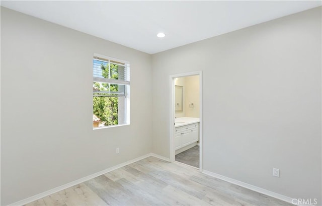 36 Chula Vis Unit 109, Irvine, CA 92602 - empty room featuring light wood finished floors, baseboards, and recessed lighting