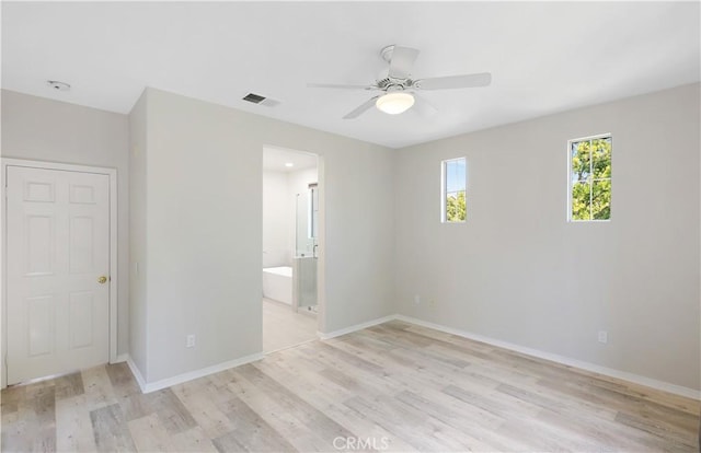 36 Chula Vis Unit 109, Irvine, CA 92602 - unfurnished bedroom with light wood-type flooring, baseboards, ensuite bath, and ceiling fan