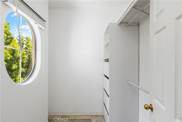 36 Chula Vis Unit 109, Irvine, CA 92602 - walk in closet featuring light wood-type flooring