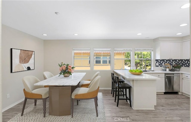 36 Chula Vis Unit 109, Irvine, CA 92602 - dining space featuring light wood-style floors, recessed lighting, and baseboards