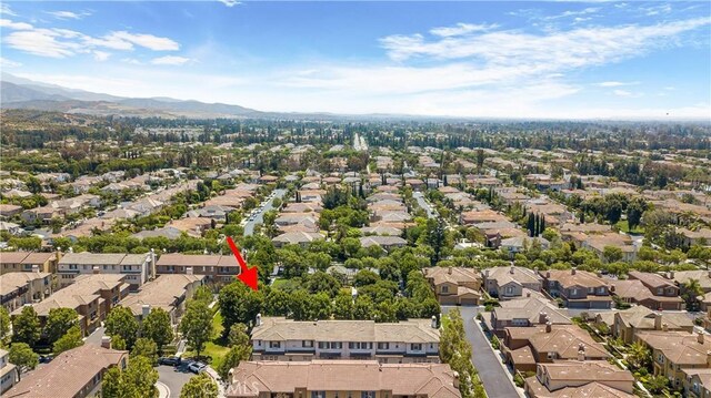 36 Chula Vis Unit 109, Irvine, CA 92602 - aerial view of property's location featuring a mountainous background and nearby suburban area