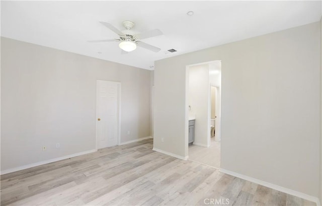36 Chula Vis Unit 109, Irvine, CA 92602 - unfurnished bedroom with light wood finished floors, baseboards, ensuite bathroom, and ceiling fan