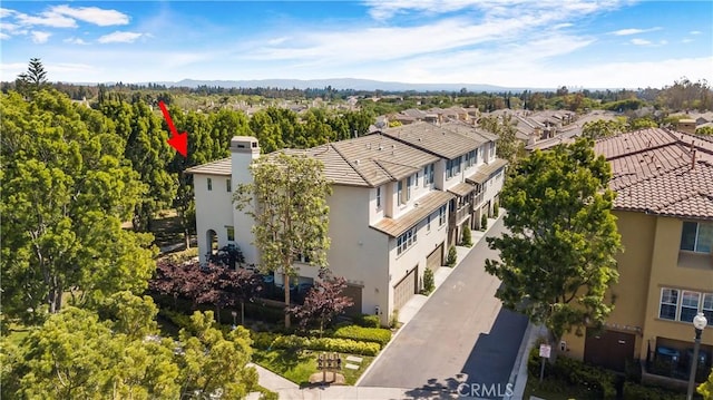 36 Chula Vis Unit 109, Irvine, CA 92602 - aerial perspective of suburban area with a mountain backdrop