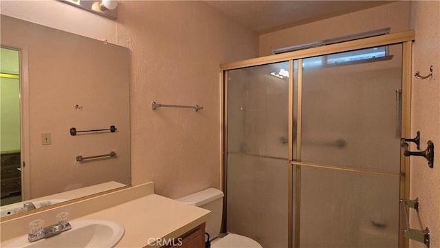 14093 Wingate Cir, Magalia, CA 95954 - bathroom featuring toilet, a shower with door, and vanity