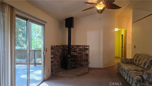 14093 Wingate Cir, Magalia, CA 95954 - living room featuring a wood stove, carpet flooring, ceiling fan, and lofted ceiling