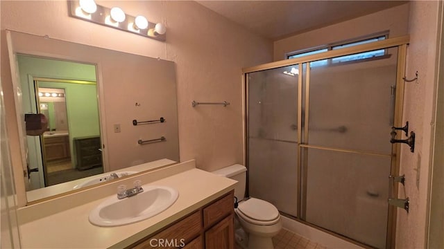 14093 Wingate Cir, Magalia, CA 95954 - bathroom featuring toilet, a shower stall, and vanity