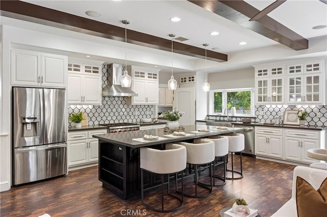 1202 Duke Ln, Walnut, CA 91789 - kitchen with appliances with stainless steel finishes, wall chimney exhaust hood, dark countertops, a center island, and decorative backsplash