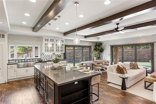 1202 Duke Ln, Walnut, CA 91789 - kitchen featuring a sink, beam ceiling, tasteful backsplash, beverage cooler, and dark wood-style flooring