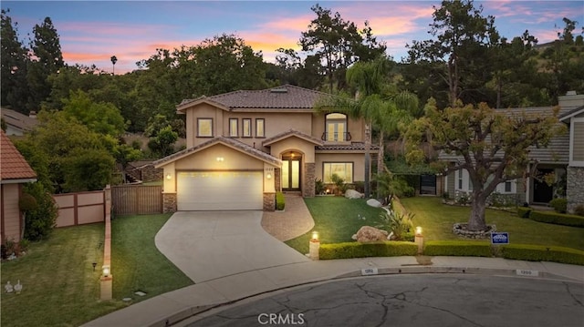 1202 Duke Ln, Walnut, CA 91789 - mediterranean / spanish house with stucco siding, stone siding, driveway, a garage, and a tile roof