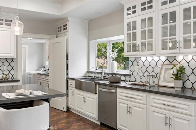 1202 Duke Ln, Walnut, CA 91789 - kitchen with stainless steel dishwasher, washer and clothes dryer, a sink, tasteful backsplash, and dark countertops