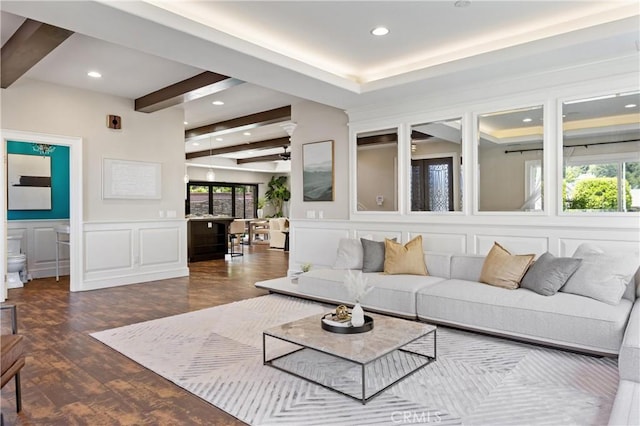 1202 Duke Ln, Walnut, CA 91789 - living room featuring a decorative wall, beam ceiling, dark wood-style flooring, recessed lighting, and wainscoting
