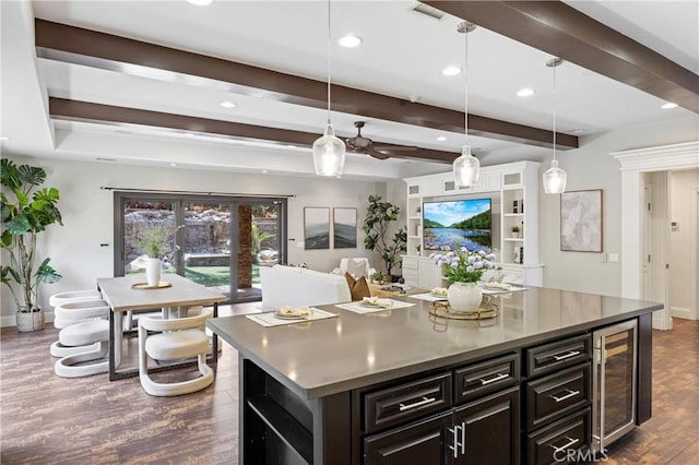 1202 Duke Ln, Walnut, CA 91789 - kitchen featuring beverage cooler, dark wood-type flooring, recessed lighting, beam ceiling, and a center island