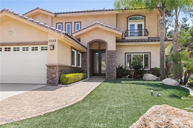 1202 Duke Ln, Walnut, CA 91789 - view of front of home with french doors, a balcony, stucco siding, a front lawn, and a garage