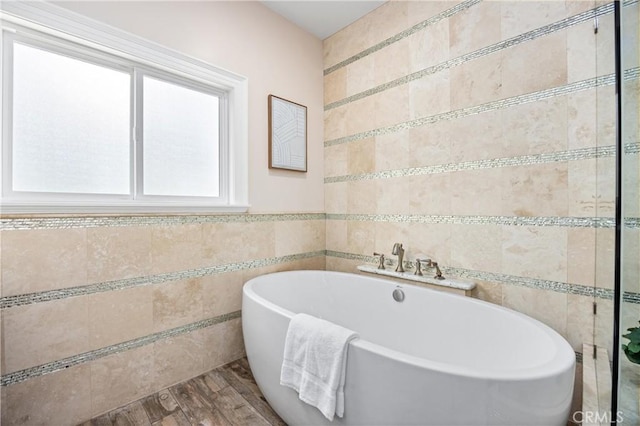1202 Duke Ln, Walnut, CA 91789 - bathroom with tile walls, a freestanding tub, and wood finished floors