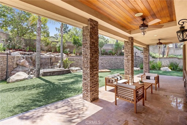 1202 Duke Ln, Walnut, CA 91789 - fenced backyard with ceiling fan, a patio area, and an outdoor hangout area