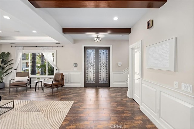 1202 Duke Ln, Walnut, CA 91789 - entrance foyer with dark wood-style flooring, french doors, a decorative wall, beam ceiling, and a wainscoted wall
