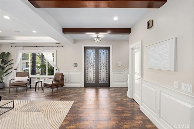 1202 Duke Ln, Walnut, CA 91789 - entryway with dark wood-type flooring, french doors, a decorative wall, beam ceiling, and a wainscoted wall