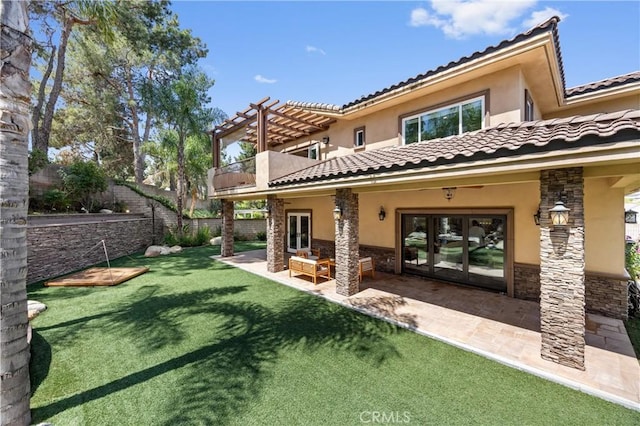 1202 Duke Ln, Walnut, CA 91789 - back of house with french doors, stone siding, stucco siding, a balcony, and a tile roof
