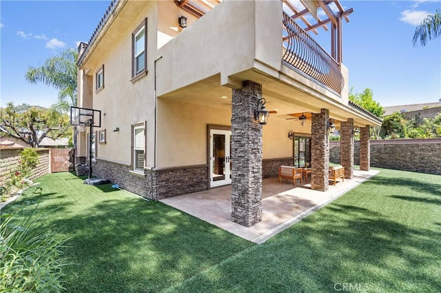 1202 Duke Ln, Walnut, CA 91789 - rear view of house featuring a balcony, stucco siding, stone siding, a ceiling fan, and a patio