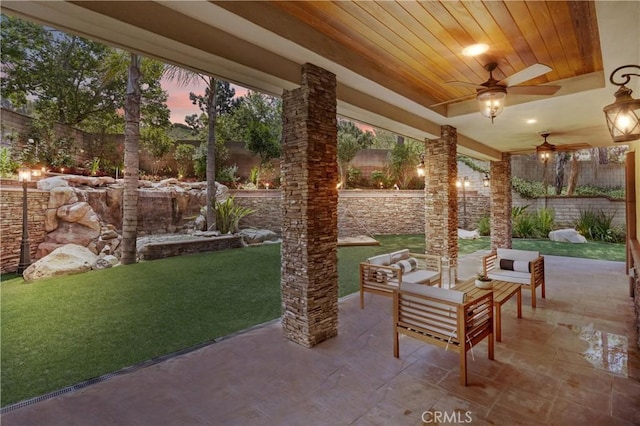 1202 Duke Ln, Walnut, CA 91789 - patio terrace at dusk featuring a fenced backyard, ceiling fan, a patio, and an outdoor hangout area