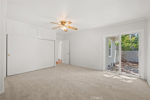 1424 E Vine Ave, West Covina, CA 91791 - unfurnished bedroom with access to exterior, light colored carpet, a closet, crown molding, and a ceiling fan