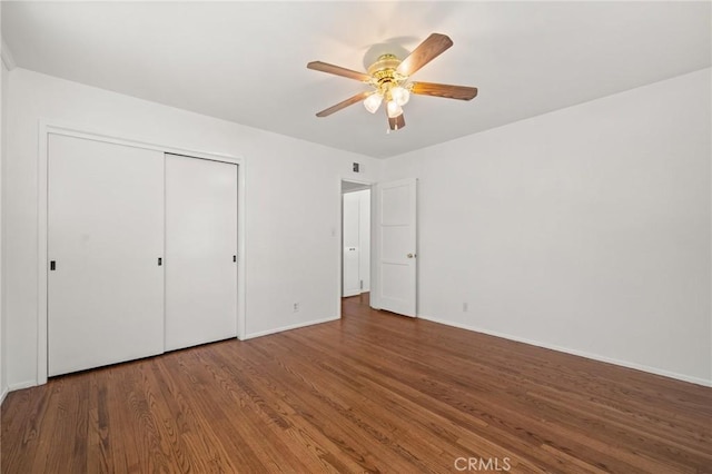1424 E Vine Ave, West Covina, CA 91791 - unfurnished bedroom with wood finished floors, baseboards, a closet, and a ceiling fan