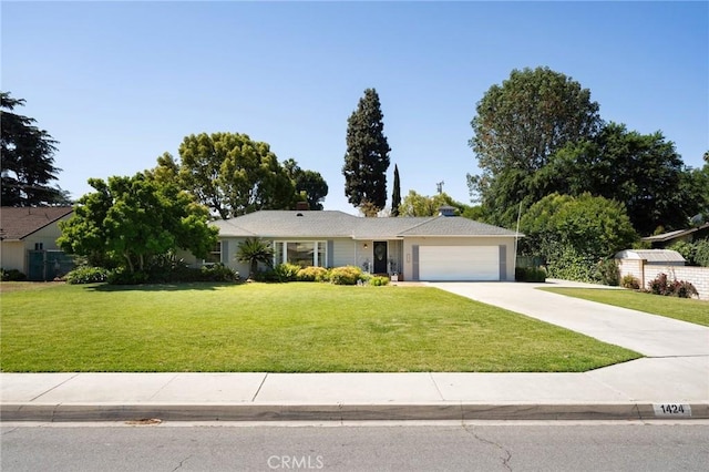 1424 E Vine Ave, West Covina, CA 91791 - ranch-style home featuring an attached garage, a front lawn, and driveway