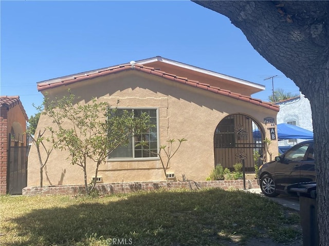 2927 Missouri Ave, South Gate, CA 90280 - view of home's exterior featuring stucco siding