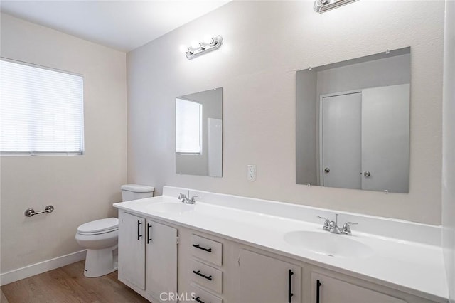 11408 Herb St Unit 7, South El Monte, CA 91733 - full bathroom featuring toilet, wood finished floors, double vanity, and baseboards